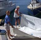 004 Ann and Gunter Fold the Mainsail