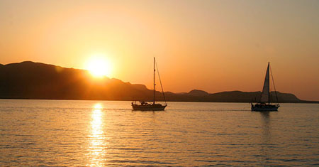 09 Aldeberan tows Alicia out of our anchorage at Port Berenice.