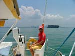 04 Wences at the helm of Simpatica in the Singapore Strait
