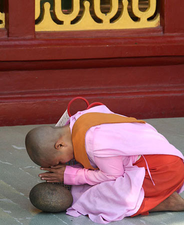 16-Nun-praying-over-stone